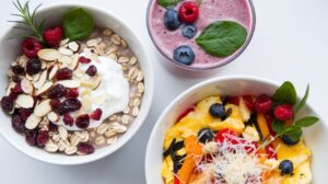  A variety of colorful breakfast bowls with healthy ingredients like eggs, avocado, grains, and vegetables for a nutritious start to the day.