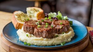 "Tender garlic butter steak bites in a skillet garnished with fresh parsley." 