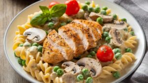 Creamy Italian chicken pasta with tender chicken, creamy sauce, and fettuccine pasta served in a bowl

