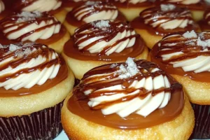 Boston Cream Pie Cupcakes topped with rich chocolate ganache and creamy pastry filling

